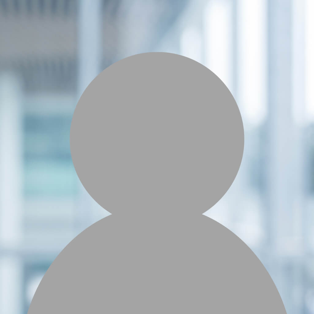 A gray generic user icon or avatar is centered against a blurred interior background with light blue and white tones, reminiscent of an office or modern building.